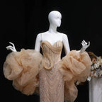 Sleeveless champagne beaded evening gown with fitted mermaid silhouette