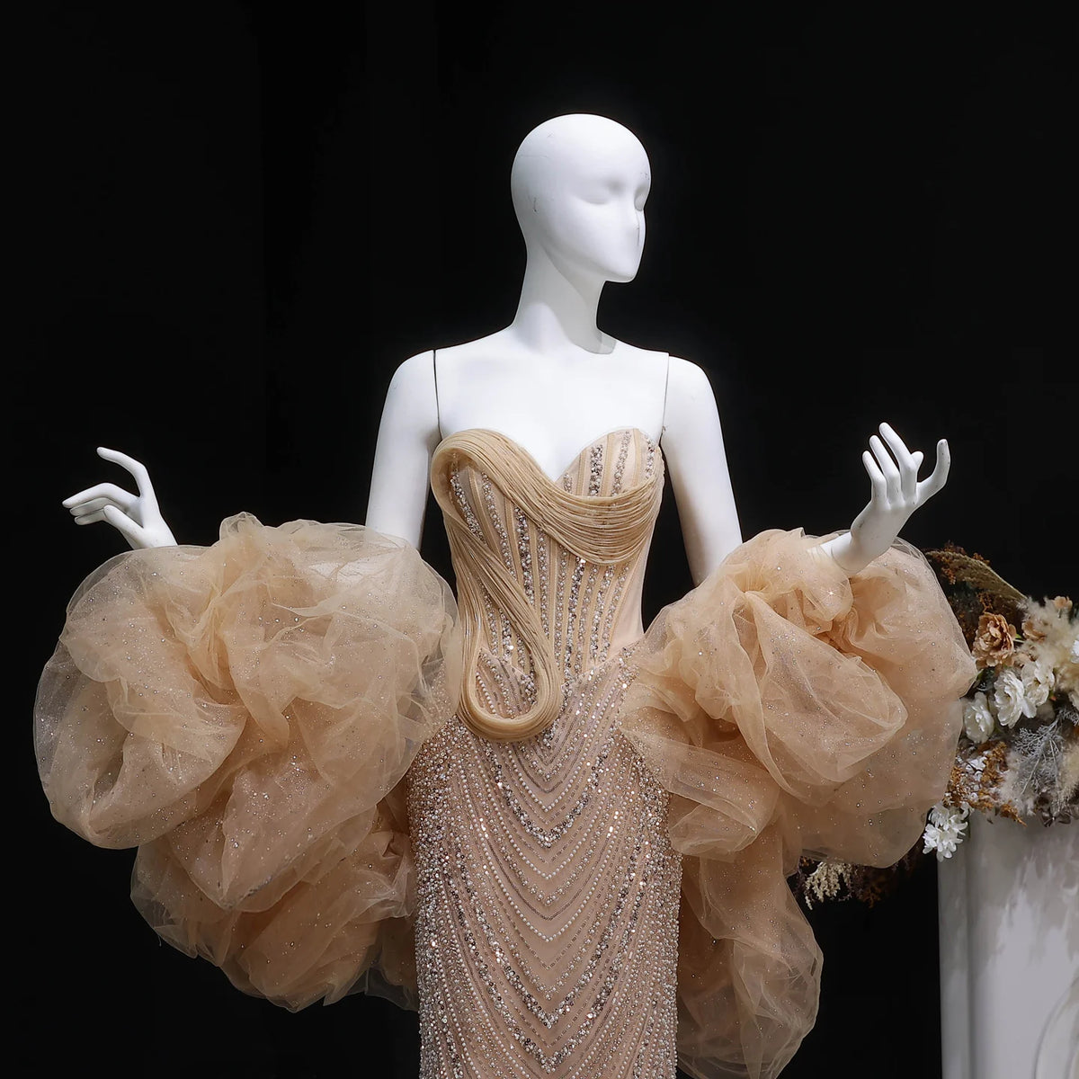 Sleeveless champagne beaded evening gown with fitted mermaid silhouette