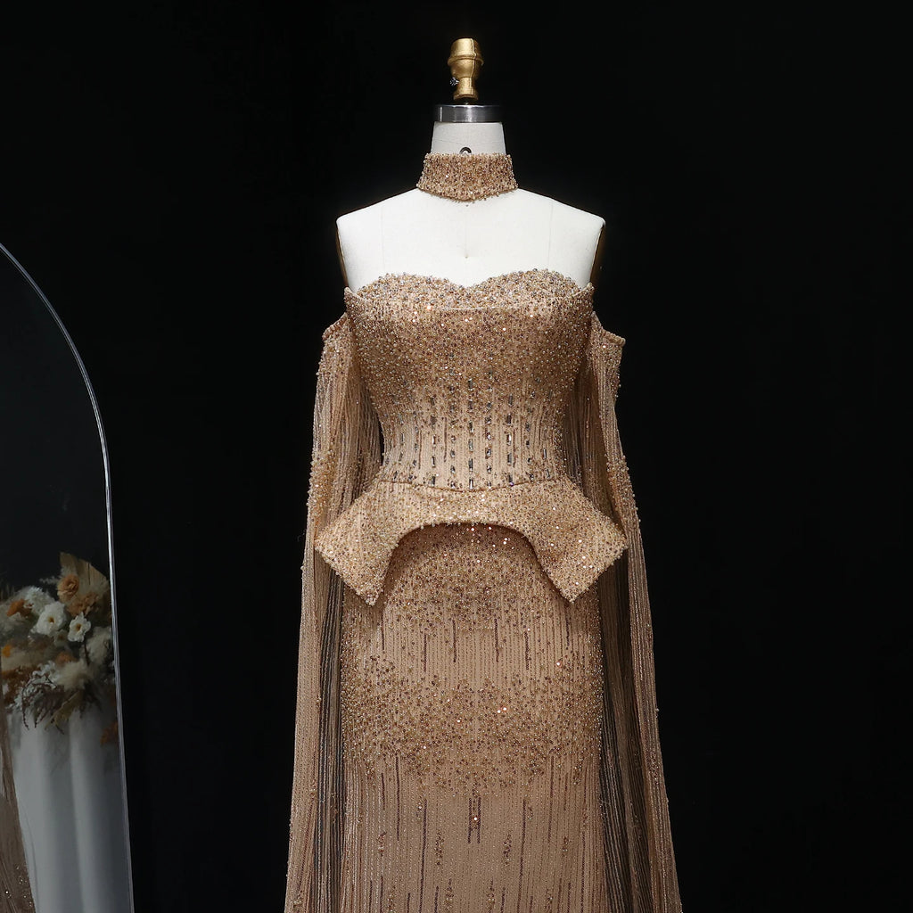 Front view of gold crystal beaded formal gown with sculptural waist detail
