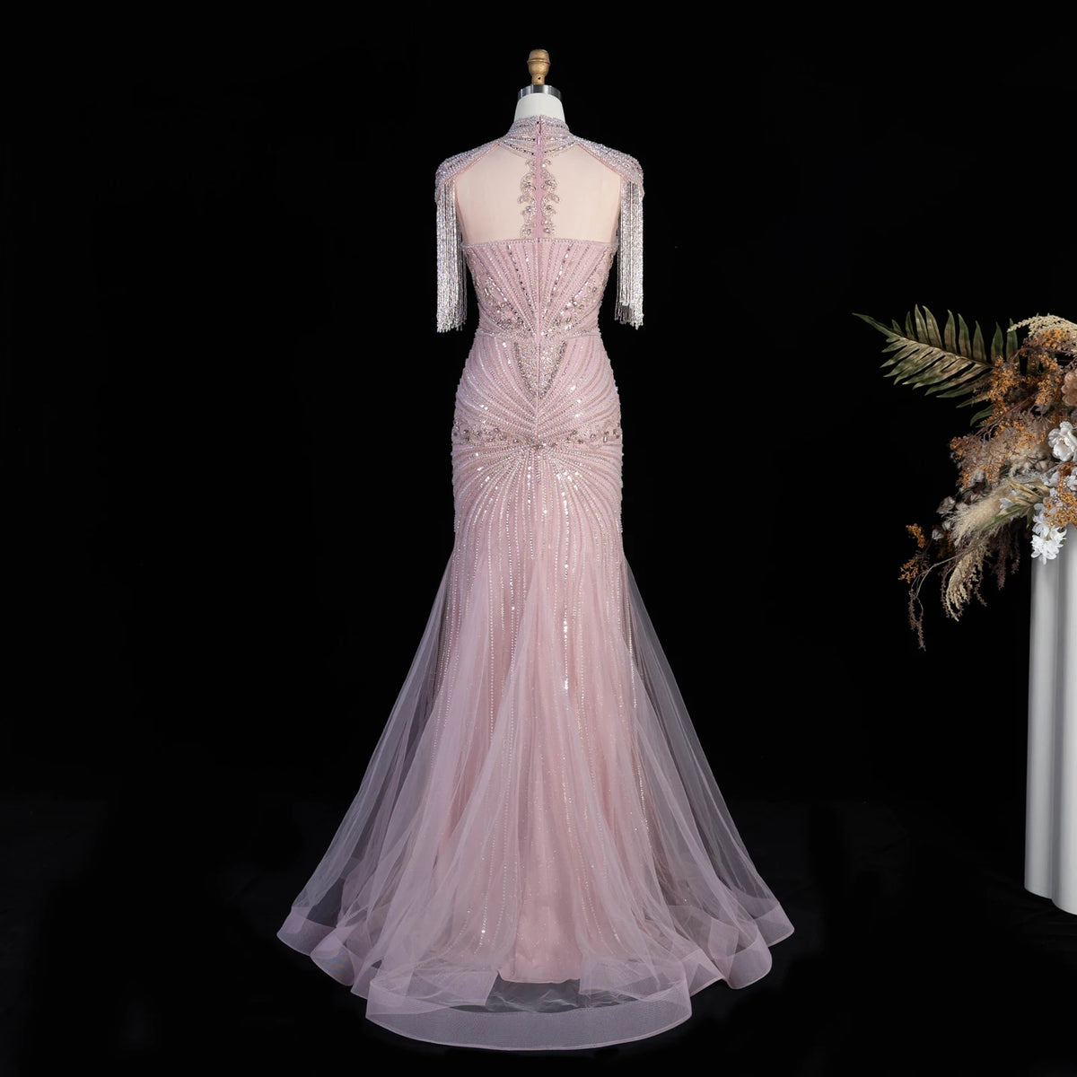 Back view of pink crystal embellished mermaid evening gown with tulle skirt