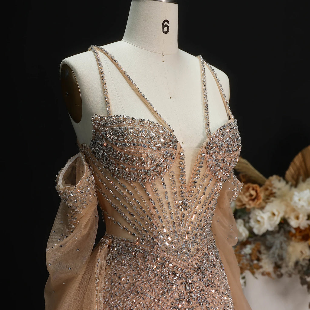 Close-up of champagne formal gown with beaded sweetheart bodice and embellishments