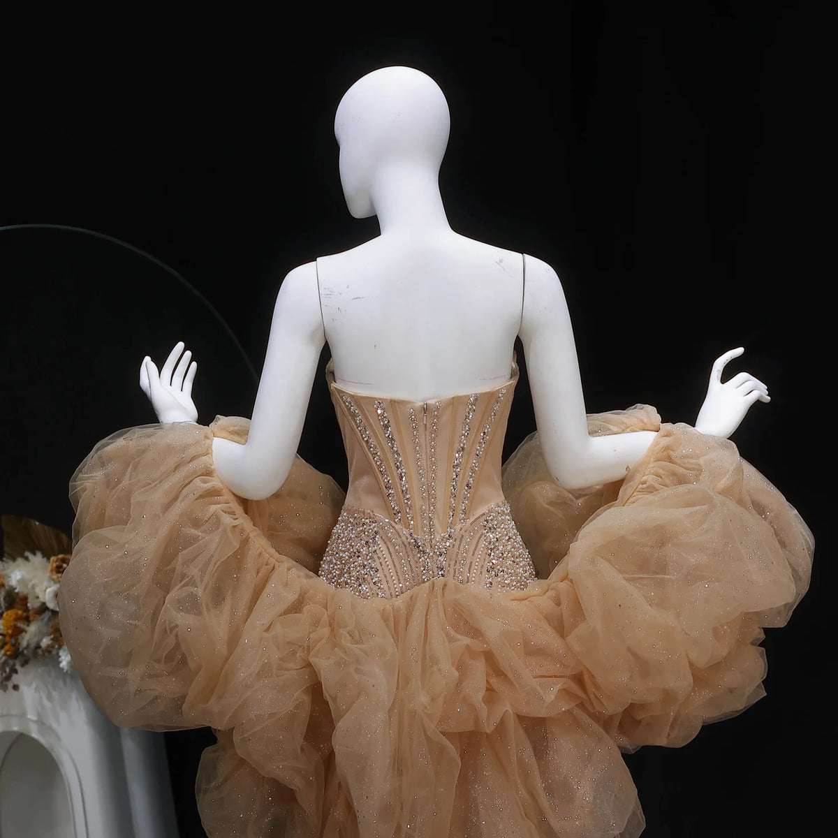 Champagne formal evening gown with cascading beadwork and dramatic tulle shawl