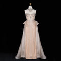 Front view of champagne crystal beaded formal gown with strapless neckline