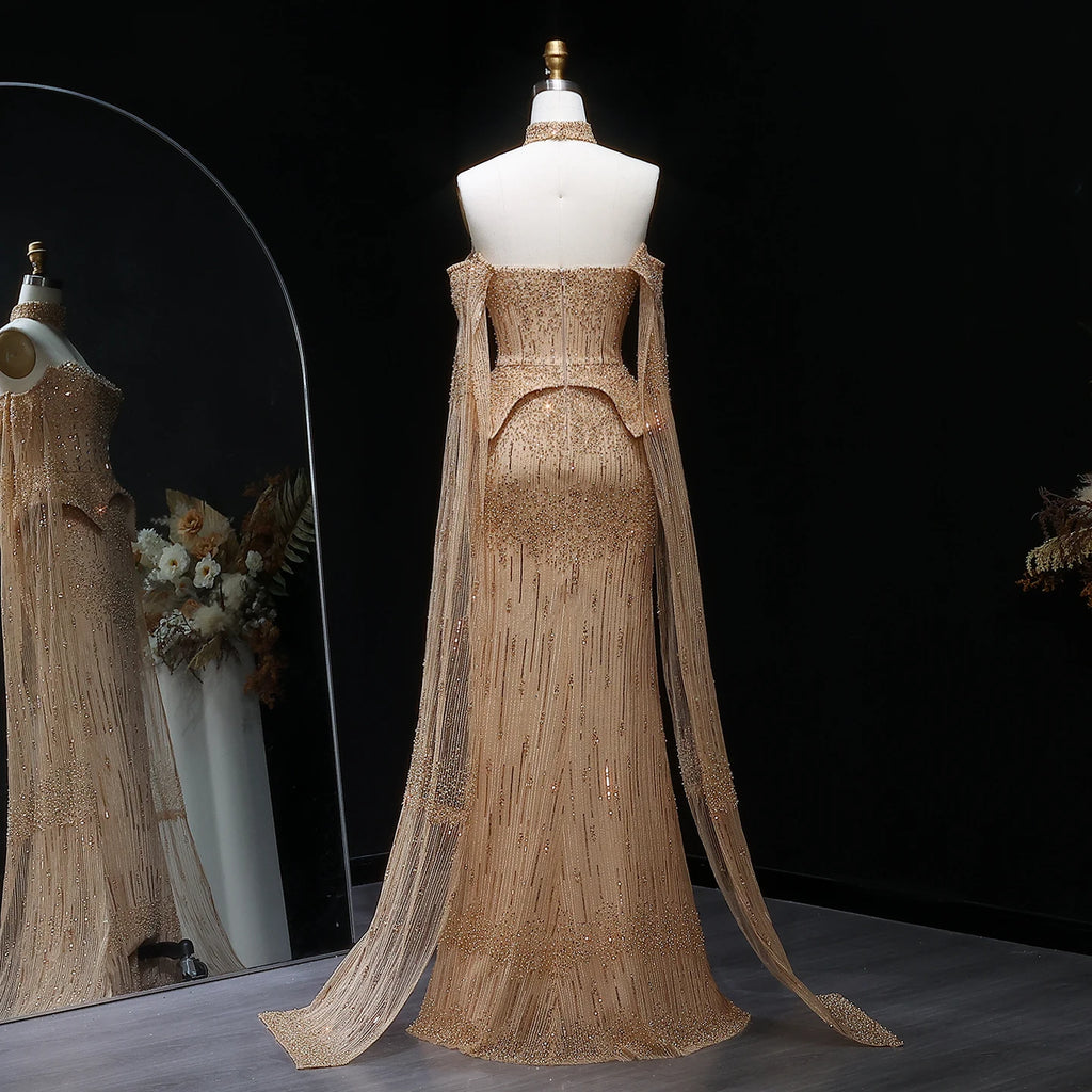 Gold formal gown with sculpted peplum waist and cascading crystal beadwork