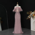 Pink feather beaded mermaid evening gown with halter neckline